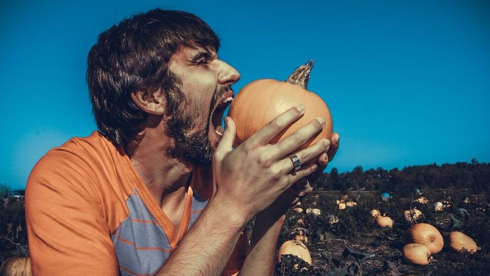 A man eats pumpkin to increase potency.